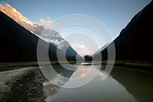 Snow mountain in sunset sunshine landscape