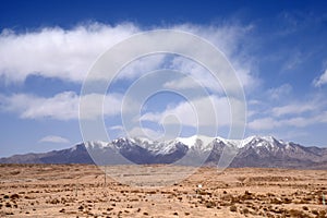 Snow mountain under cloudy sky