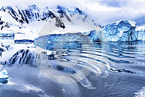 Snow Mountains Blue Glaciers Refection Dorian Bay Antarctica photo