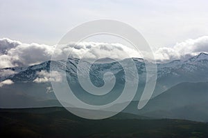 Snow mountains in clouds, located in Galicia, Spain. photo