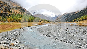 Snow mountains and river in Samedan