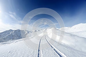 Snow mountains with road