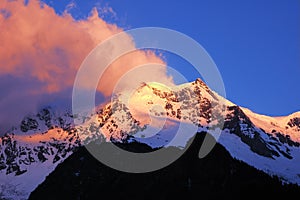 Snow mountains in sunglow