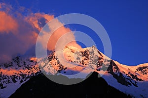 Snow mountains in sunglow