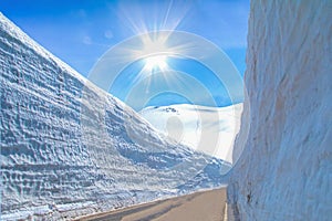 The snow mountains wall of Tateyama Kurobe alpine with blue sky