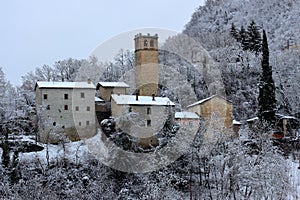 Snow and nature landscapes and forests whitened by the first snowfalls in the northern Apennines between modena and bologna