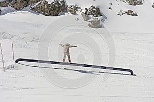Snow park pipe tricks. Snowboarder in the park on a pipex. Winter jibbing in snwopark in Alps. Snow park in alps. Snow park tricks