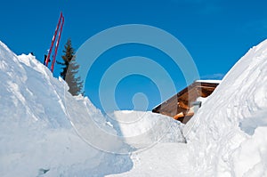 Snow path to an alpine mountain ski hut