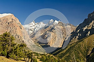 Snow peacks above valley