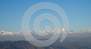 Snow peaked himalayan ranges with blue sky