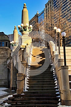 Snow piles on stairway leading up and away from the riverwalk in downtown Chicago Loop photo