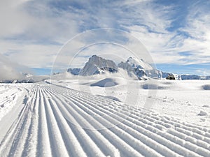 Snow plough in Dolomites photo