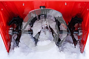 Snow plow auger in the snow close up