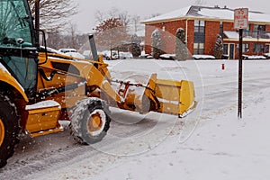 Snow plow doing removal after a blizzard photo