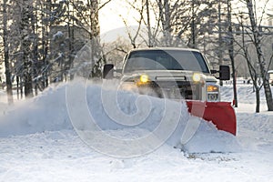 Snow plow doing snow removal after a blizzard photo