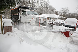 Snow Plow Removing Snow From City Street.