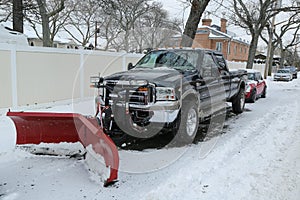 Snow plow truck in Brooklyn, NY ready to clean streets after massive Winter Storm Helen strikes Northeast