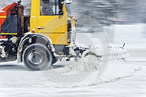 Snow plow truck at work