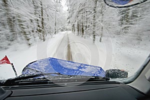 Snow plow at work - plowing snow from road