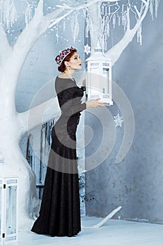 Snow Queen, december. Elegant woman in long dress. Winter