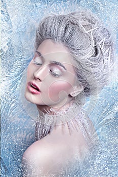 Snow Queen.Fantasy girl portrait. Winter fairy portrait.Young woman with creative silver artistic make-up. Winter Portrait.