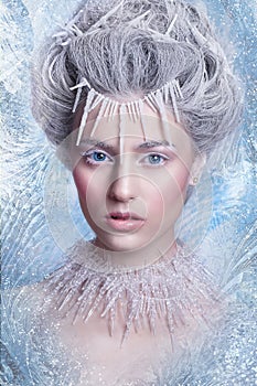 Snow Queen. Fantasy girl portrait. Winter fairy portrait. Young woman with creative silver artistic make-up. Winter Portrait.