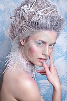 Snow Queen.Fantasy girl portrait. Winter fairy portrait.Young woman with creative silver artistic make-up. Winter Portrait.