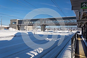 Snow on railway station with blue sky in Japan.