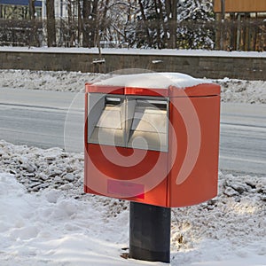 Snow and Red mailbox of Japan Post Service in Japan.