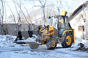 Snow removal equipment, bulldozer machine, cleaning of melted snow, Springtime