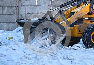 Snow removal equipment, bulldozer machine, cleaning of melted snow, Springtime