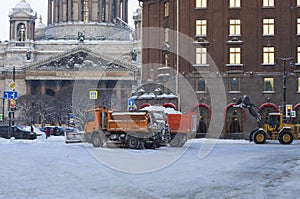 Snow removal equipment clears the city of the fallen snow