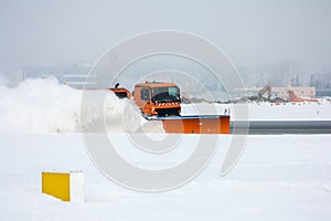 Snow-removal machine cleans the runway at the airport