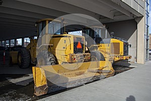 Snow Removal Plow and Wheel Loader in CIty Parkade