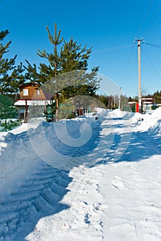 Snow-removed road in countryside