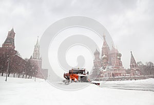 Snow-remover truck clean road near Red Square