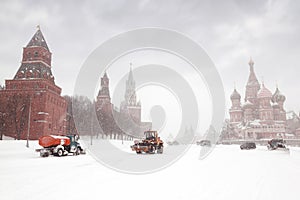 Snow-remover trucks and tractor near Red Square photo
