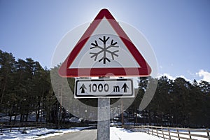 Snow road sign on a local mountain road photo