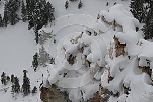Snow on rock formation in yellowstone national park