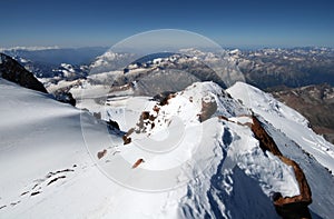 Snow rocks in high mountains from peak Elbrus