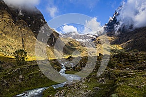 Snow, rocks and river in El Altar volcano