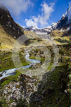 Snow, rocks and river in El Altar volcano