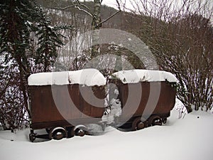 snow on rusty wagons