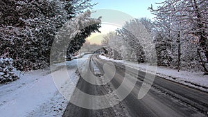 Snow scene country lane with tracks