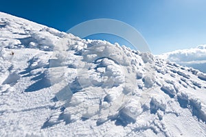 snow shaped by the wind