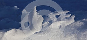 Snow shaped by wind and weather.