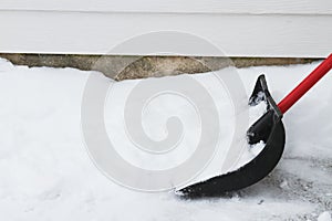 Snow Shovel on the driveway photo