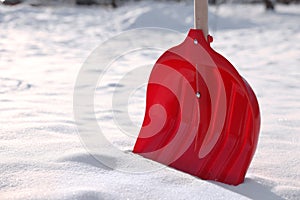 Snow shovel with wooden handle outdoors, closeup. Space for text