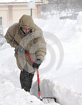 Snow Shoveling In Winter Blizzard