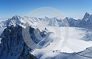 Snow slope with mountain-skiers, the Alps